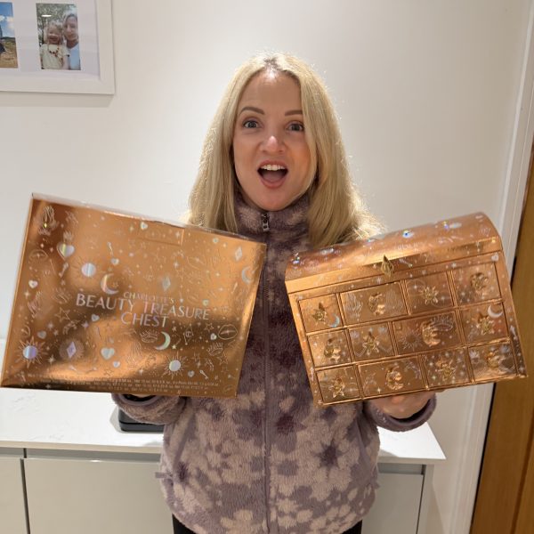 Charlotte Tilbury Beauty Treasure Chest 12-door advent calendar displayed with premium skincare and makeup products. Luxury beauty prize worth £175 with 99p tickets and live draw on Wednesday 19th November.