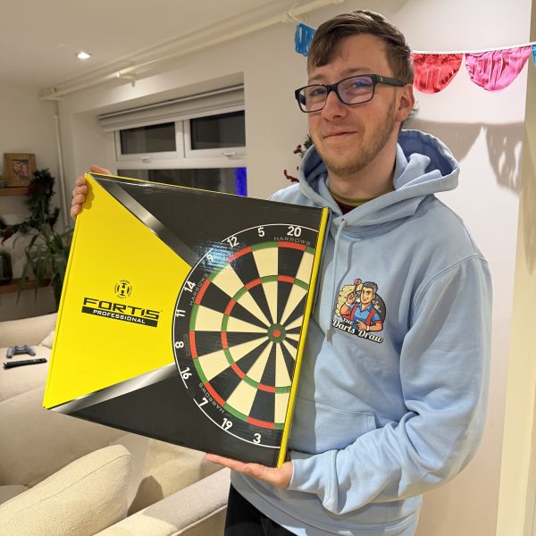 New Harrows Fortise dartboard shown mounted and ready for play, with a £60 cash alternative available.